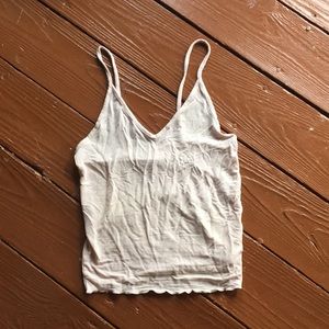 Light pink tank top: brand is “Hollister”